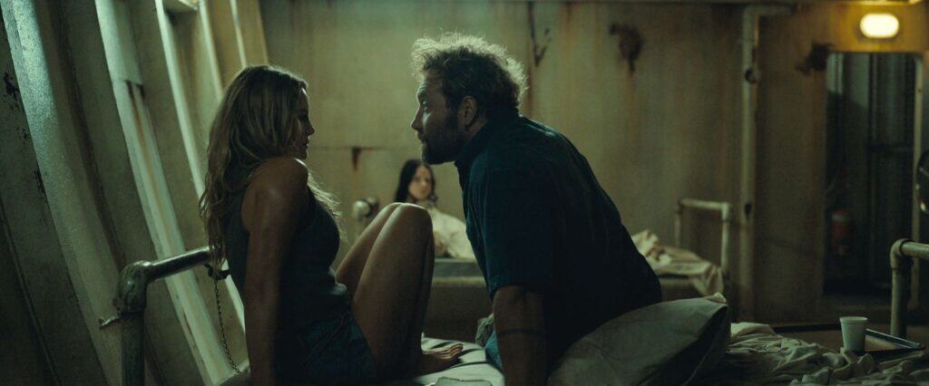 Hassie Harrison and Jai Courtney in Dangerous Animals (2025).